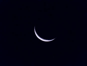 Low angle view of moon in sky at night