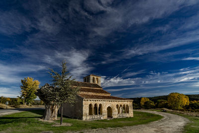 Historic building against cloudy sky