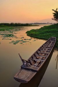 Scenic view of river against sky during sunset