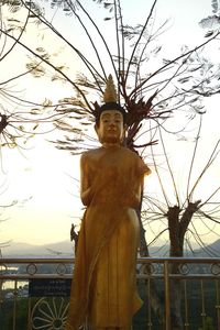 Low angle view of statue against sky