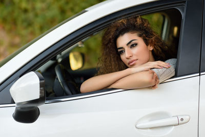 Young woman traveling in car