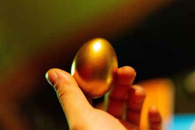 Close-up of person holding ball