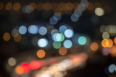 Defocused image of illuminated lights at night