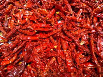 Full frame shot of red chili peppers for sale in market