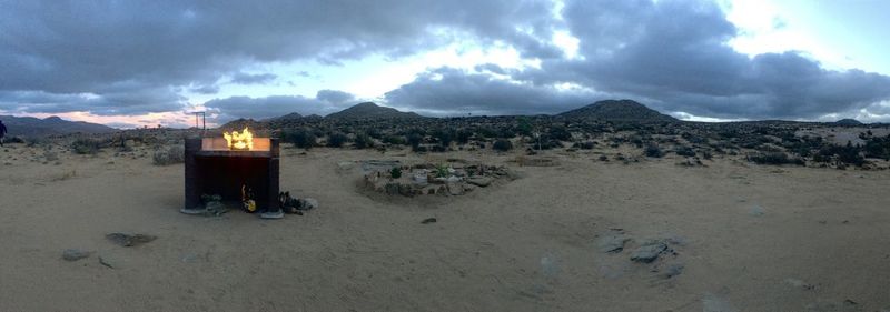 Panoramic view of land and mountains against sky