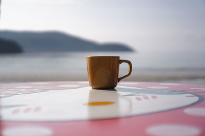 Close-up of coffee cup on table