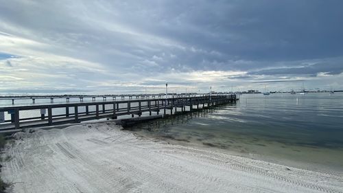 Pier over sea against sky
