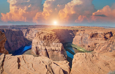 Panoramic view of rock formations against sky during sunset