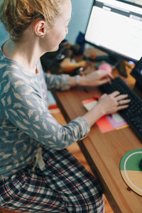 High angle view of woman using mobile phone