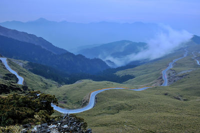 High angle view of road amidst mountains against sky