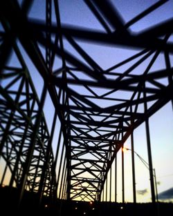 Low angle view of metal structure against sky