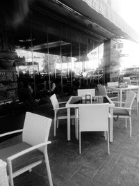 Empty chairs and tables in cafe