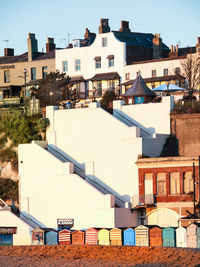 Houses in town against clear sky