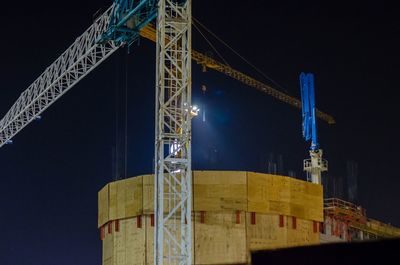 Low angle view of crane at construction site