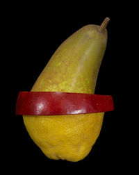 Close-up of apple against black background