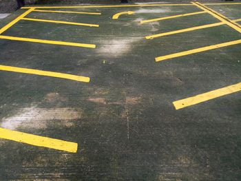 High angle view of arrow sign on road