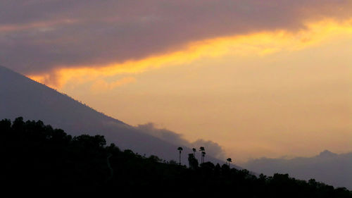 Scenic view of silhouette trees against sky during sunset