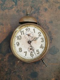 Close-up of clock on table