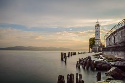 Panoramic view of buildings against cloudy sky