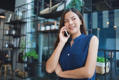 Young woman talking on phone