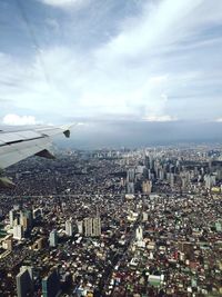 Aerial view of city against sky