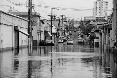 Boats in water against sky