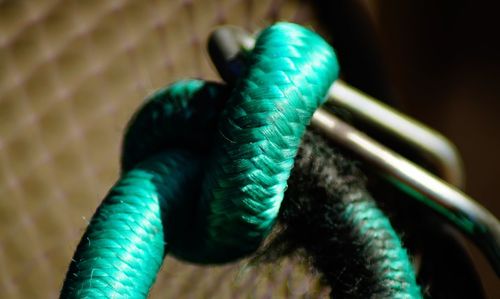 Close-up of rope tied on metal