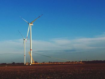 Wind turbines in field