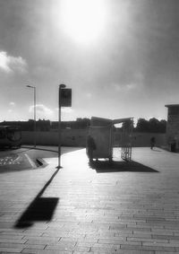 Empty road with buildings in background