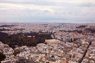 High angle view of townscape against cloudy sky