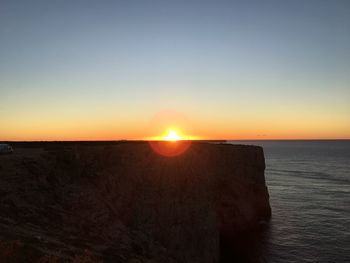 Scenic view of sea against clear sky during sunset