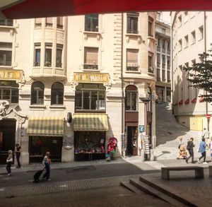 People walking on street in city