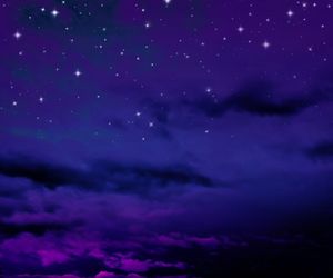 Low angle view of dramatic sky at night