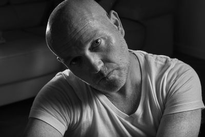 Close-up portrait of mature man sitting at home