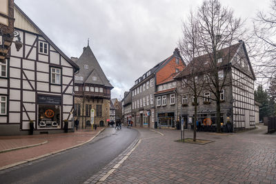 Street amidst buildings against sky