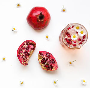 High angle view of strawberries on table against white background