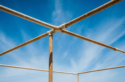 Low angle view of metallic structure against sky