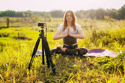 Close-up of the camera on which the girl is recording a video lesson about yoga. yoga online