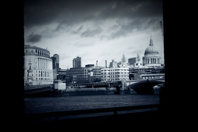 Cityscape against cloudy sky