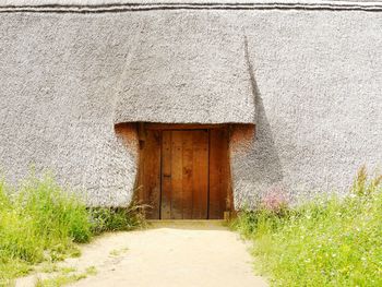 Closed wooden door of old house