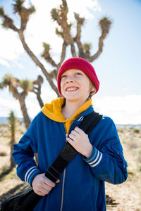 Portrait of tween smiling while out exploring joshua tree