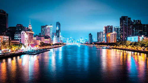 Illuminated buildings in city at night