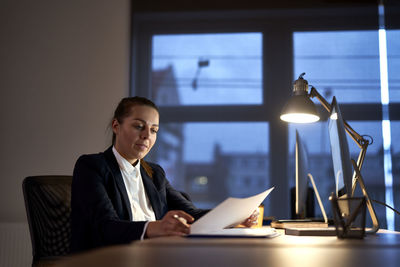Businesswoman using laptop at office