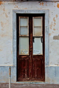 Close-up of closed door of abandoned building