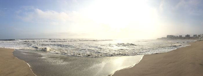 Panoramic view of beach against clear sky