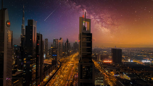 Illuminated modern buildings in city at night