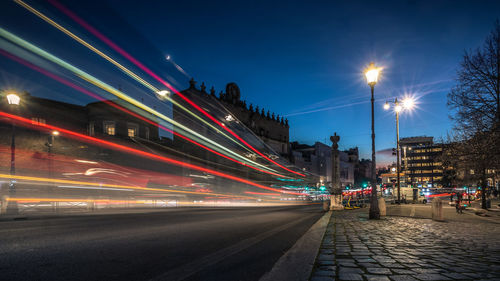 Light trails on road in city at night