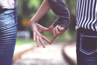 Cupids making heart shape with hands 