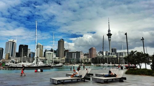 City skyline against cloudy sky