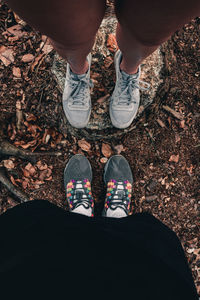 Low section of people standing on land